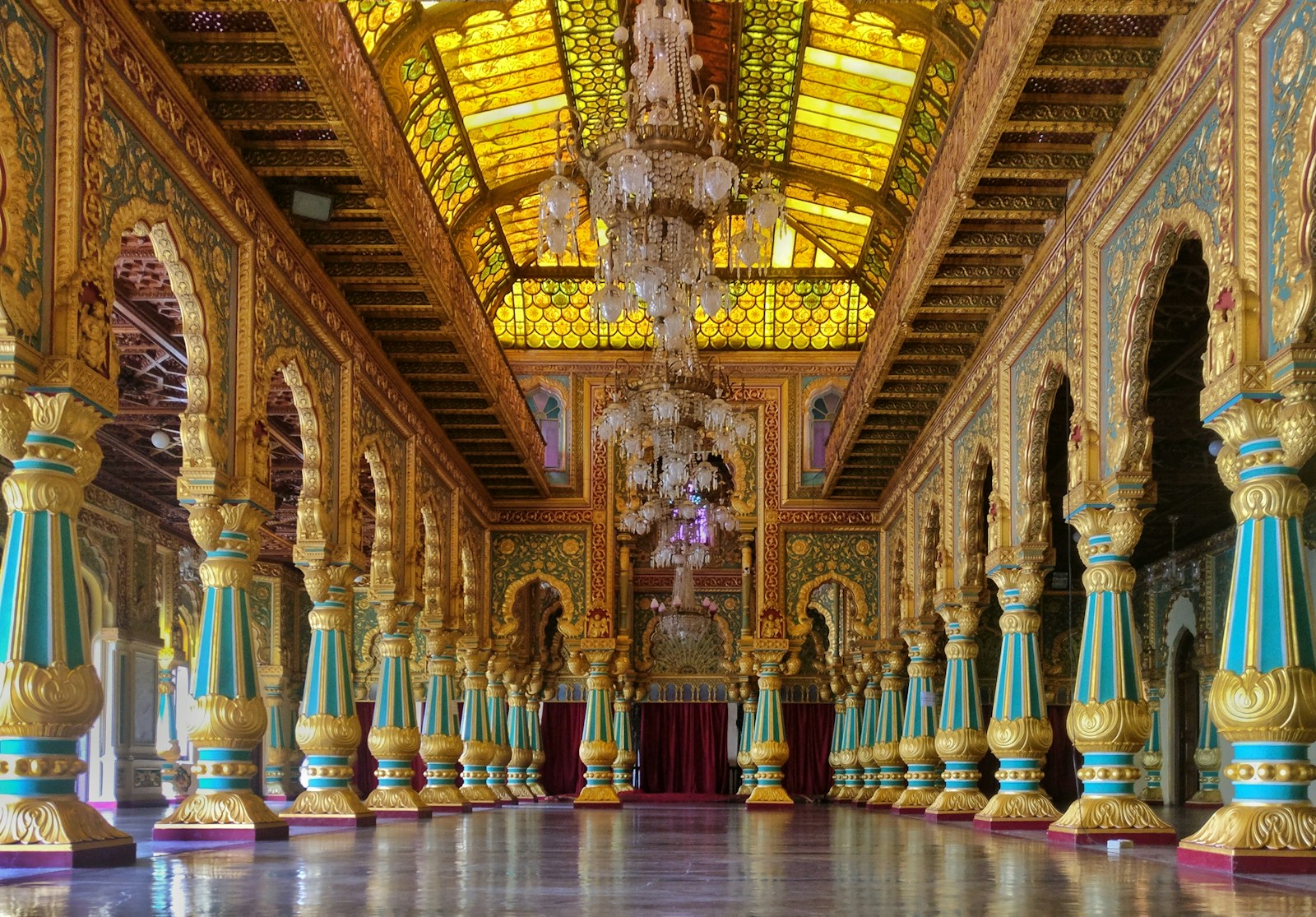 a large ornate room with colorful pillars