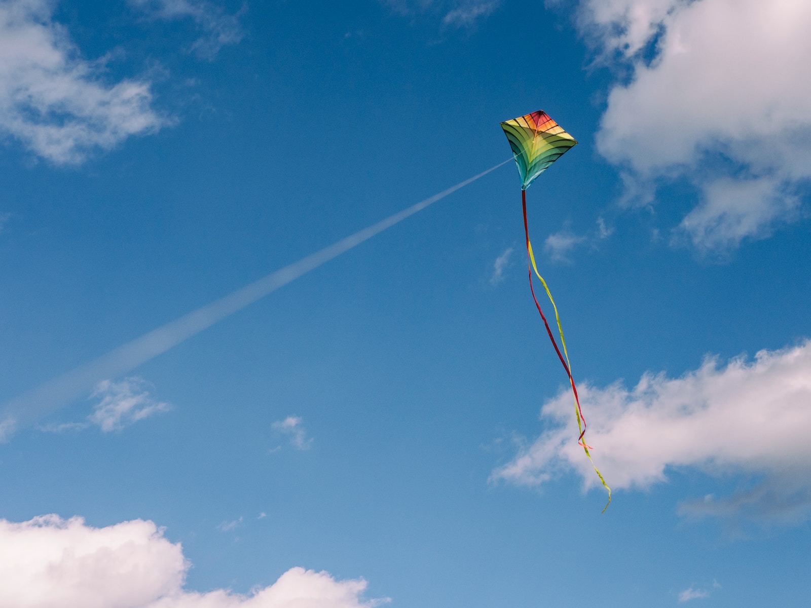 green and yellow kite on air